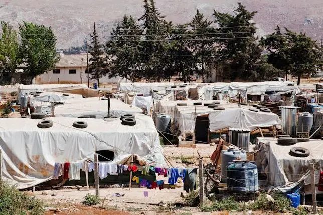 Syrian refugees live in the white tents