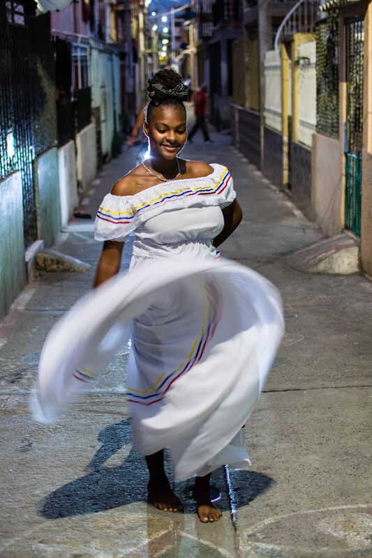 Hillary Hidalgo Nuñez is dancing in the street.