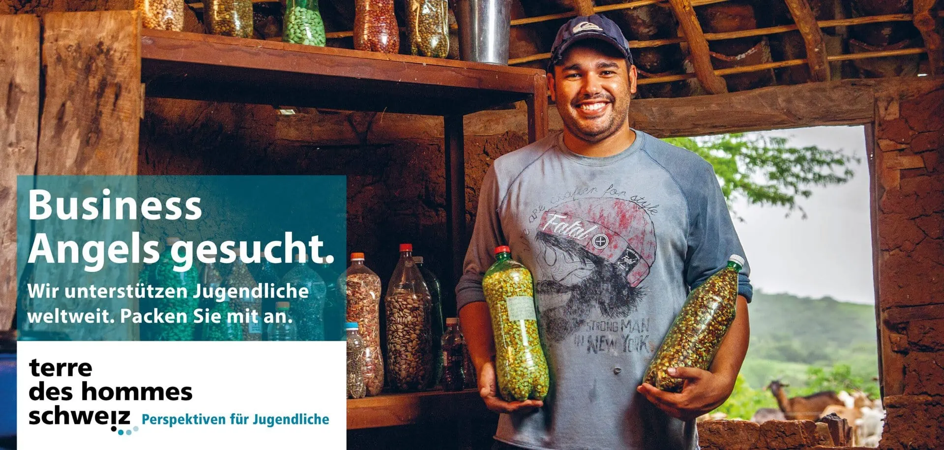 Young-man-happily-and-proudly-holding-two-seed-filled-pet-bottles-in-his-hands