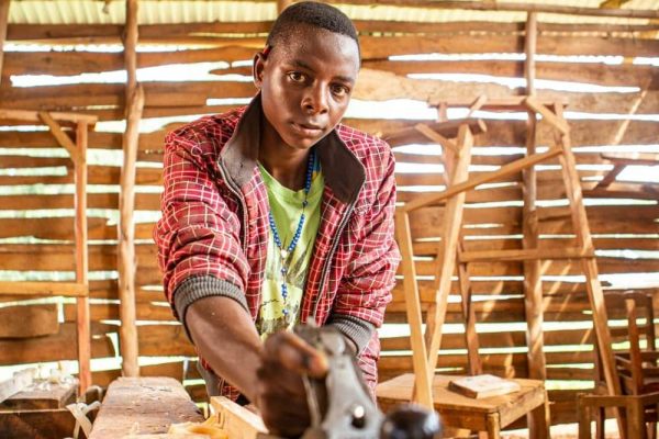 In the workshop, Mberwa builds his future